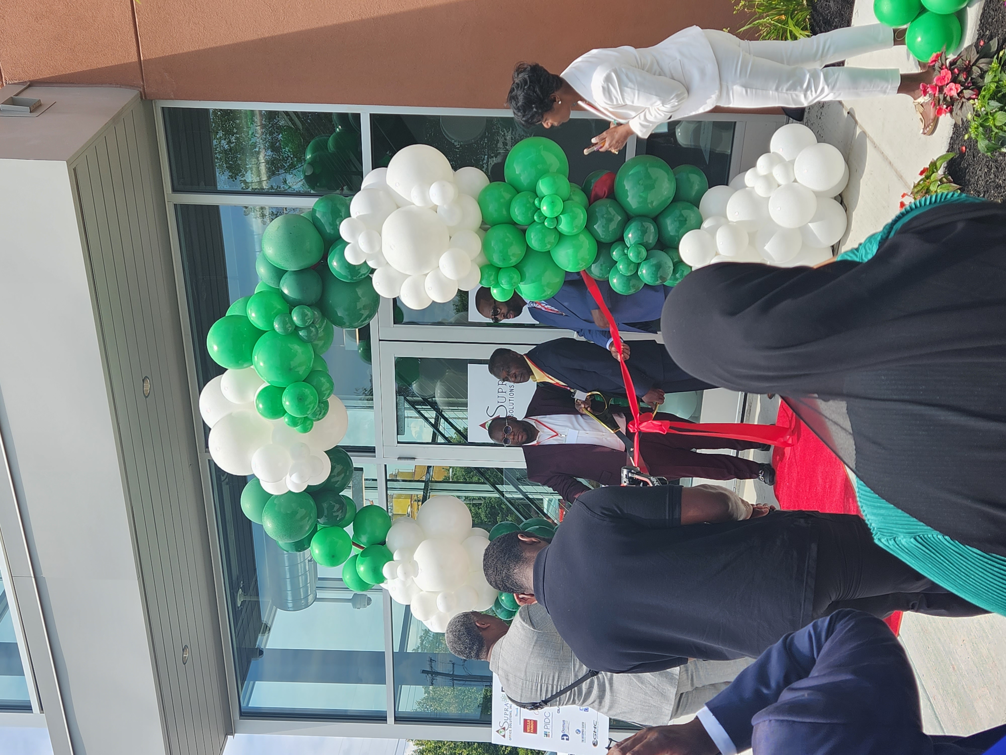 Photo of people cutting the ribbon at SUPRA Grand Opening of new facility